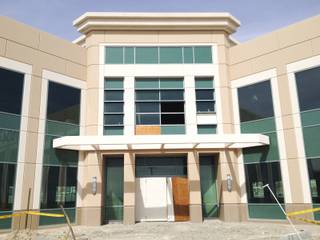 The entrance to a two-story office building on site at the mothballed medical-office project Centennial Hills Center shows signs of vandalism March 20, 2014. The center has new ownership and is slated for completion after being abandoned by collapsed lender Lehman Brothers.